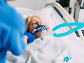 Female patient in critical care receiving blood purification therapy