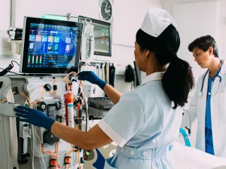 Female nurse conducting blood purification therapy